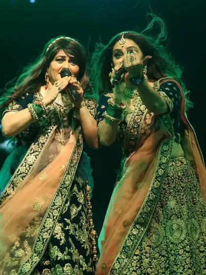A shot of us singing in unison, showcasing our harmony as a duo. This is what makes the Preety & Pinky sound unique.