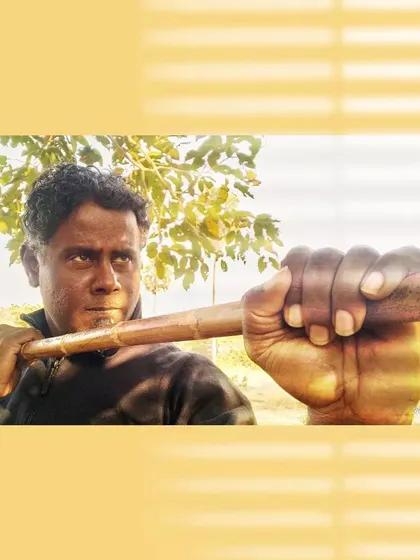 A close-up, intense shot with the Bo Staff, emphasizing the grip and readiness for action.