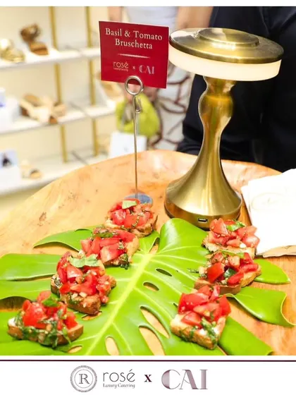 Fresh Basil and Tomato Bruschetta served on a monstera leaf for a tropical and stylish presentation. This was part of our catering for the CAI store launch in Delhi.