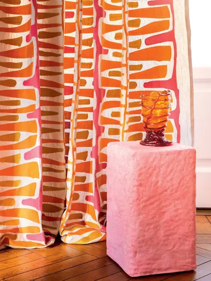 A close-up of the Élitis drapery reveals the bold, abstract pattern and vibrant color combination. This fabric is perfect for making a fearless design statement, transforming any room with its expressive artistry.
