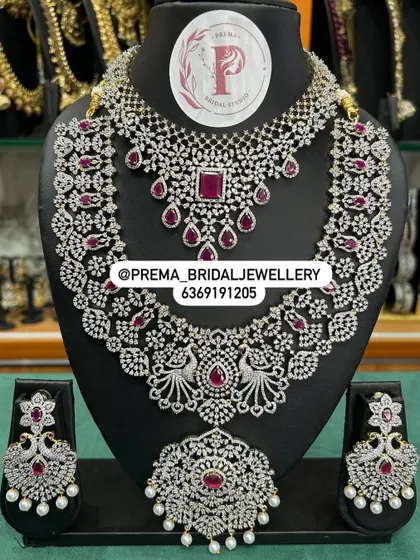 A grand AD and ruby bridal set with peacock motifs.