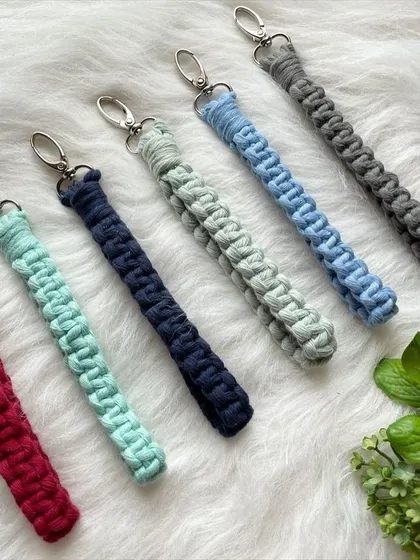 This collection of macrame wristlet keychains features a cool-toned palette, including shades of red, teal, navy, blue, and grey. All my keychains can be customized in your favorite colors.
