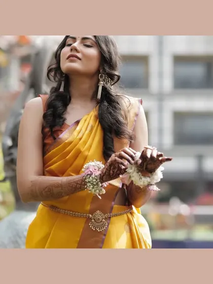 A beautiful candid portrait of the bride during her Haldi ceremony in Siliguri, enjoying the sun.