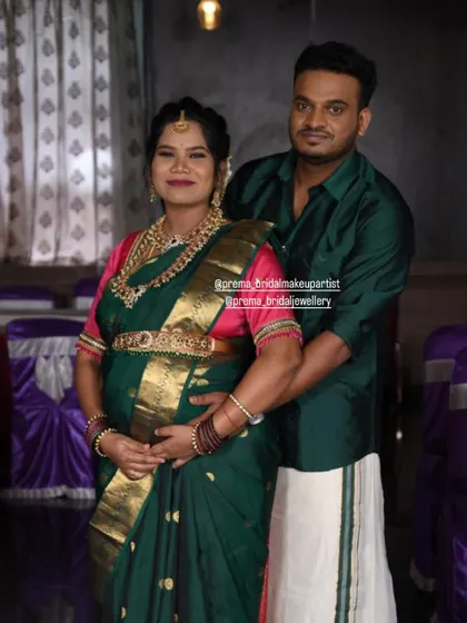 The expecting couple posing together, with the mom-to-be looking beautiful in her jewellery.