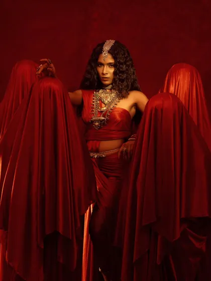 A wider view of the conceptual jewelry shoot, showing the model as a central, powerful figure. This is art direction and storytelling for a brand.