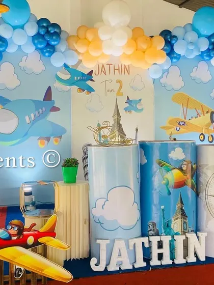 Another shot of the 'Flying High' airplane theme, showing the detailed props and balloon clouds.