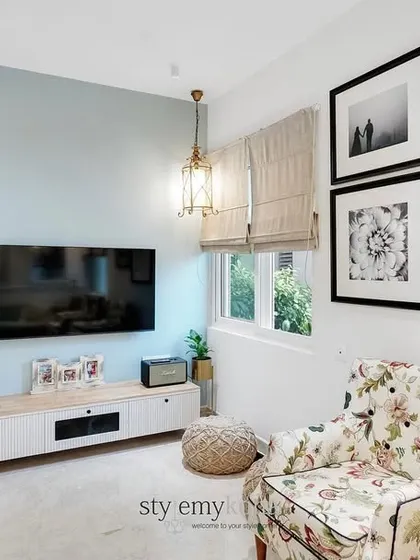 Even a small living room can look phenomenal. Here, we used smart lighting and mounted the TV to keep the floor clear, making the space feel larger and more open.