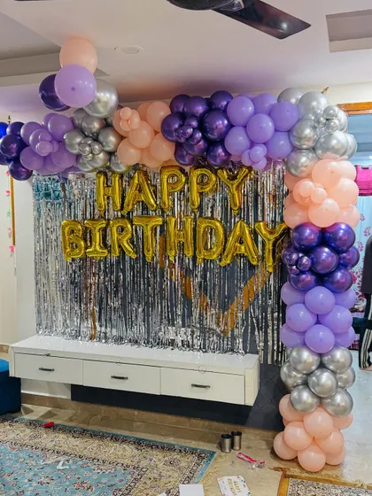 A full view of the living room birthday setup, showing how it transforms the space.