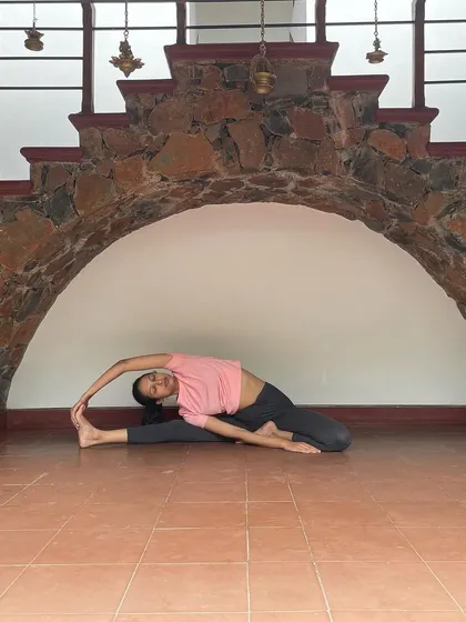 This is Parivrtta Janu Sirsasana, or Revolved Head-to-Knee Pose. It's a deep side bend that stretches the hamstrings, spine, and shoulders all at once.