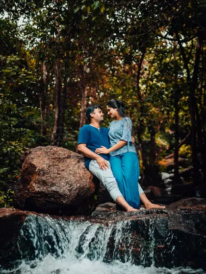 A serene pre-wedding moment by a waterfall. We find tranquil natural spots that add a sense of peace and beauty to your photos.
