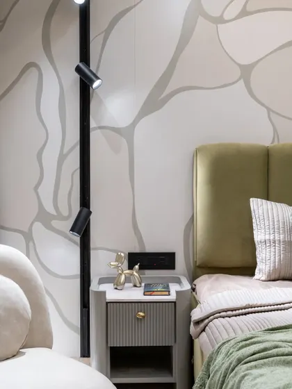 Art meets comfort in this serene sanctuary. The hand-painted wall art is a statement of personality, flow, and bespoke charm. Paired with a plush olive green headboard and soft neutral textures, this is where creativity sleeps in style.