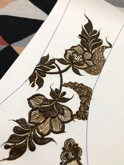 A close-up of the practice design with glitter details.