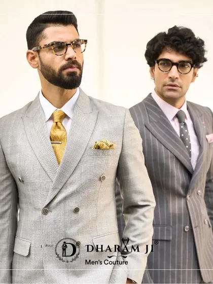 Two examples of my double-breasted suits. On the left, a light grey suit with a gold tie, and on the right, a pinstripe suit. Both are tailored to perfection for a sharp, professional look.