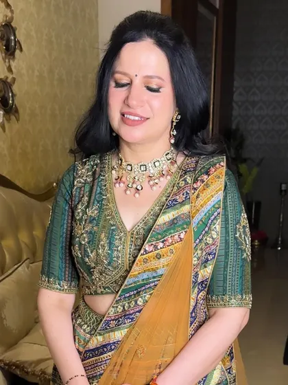 A close-up of the soft and elegant makeup for the mother of the bride. The focus is on creating a smooth, lifted look for mature skin.