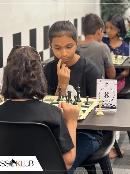 Two young girls compete with intense focus during our Independence Day tournament, showcasing the growing number of female players in our community.