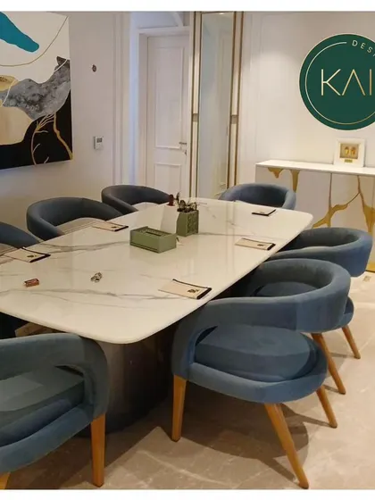 A complete dining room setup we delivered, featuring a white marble table, modern blue chairs, and a matching console with a distinctive gold-vein design. This project showcases our ability to furnish an entire space with cohesive, custom pieces.