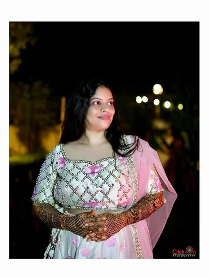 A thoughtful, candid portrait of the bride during her Mehndi celebration.