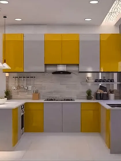 This U-shaped kitchen uses a two-tone color scheme of grey and yellow for a playful yet modern look. The layout provides ample counter space and storage, making it an efficient and enjoyable cooking environment.