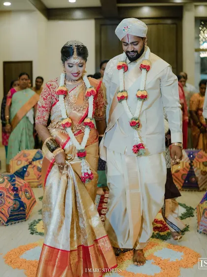 The bride and groom during their wedding ceremony, a picture of happiness and tradition.
