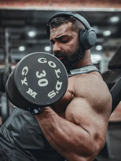 Another shot of the incline dumbbell curl, focusing on the contraction at the top of the movement.