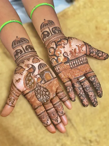 A lovely design combining peacocks, elephants, and architectural elements. This is a great example of how different traditional motifs can be woven together.