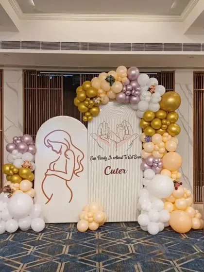 For this baby shower, I created an elegant and modern backdrop using arched panels and a custom organic balloon garland. The soft colors and clean lines are perfect for a sophisticated celebration for the mom-to-be.