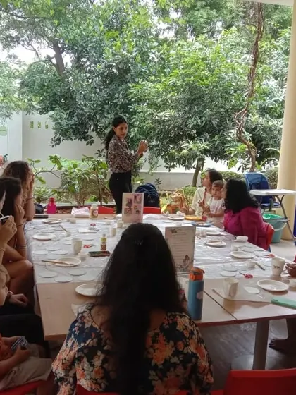 A wide shot of our Mother's Day decoupage event, where moms and kids gathered around the table to create personalized keepsakes together.