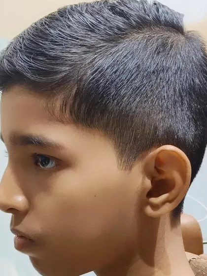 Your style, your way. A classic, neat haircut for a young boy.