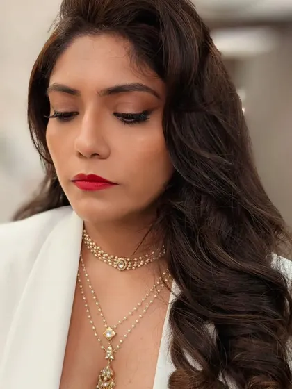 A close-up of the classic red lip and winged eyeliner. This look is timelessly chic and was perfect for my client attending her best friend's wedding.