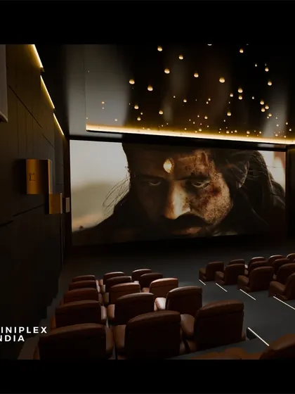 A side view of the same multiplex concept, emphasizing the wall-mounted speakers and acoustic paneling that are crucial for delivering clear sound throughout a large space.