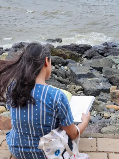 Reading by the sea, letting the stories of food and memory wash over.