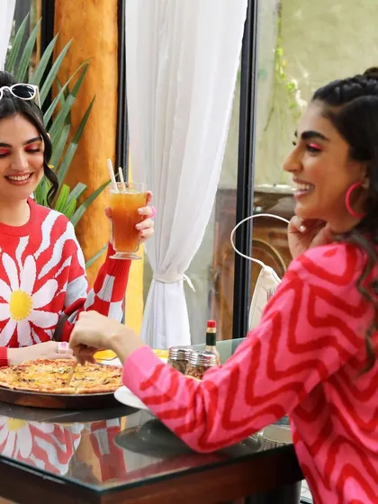 A candid-style lifestyle shot for a campaign. I styled these two models in colorful, retro-inspired sweaters for a casual brunch scene, creating a relatable and friendly vibe.