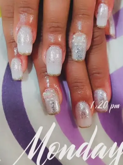 A full set of sparkling white and silver glitter nails. This is a great look for weddings or festive parties.