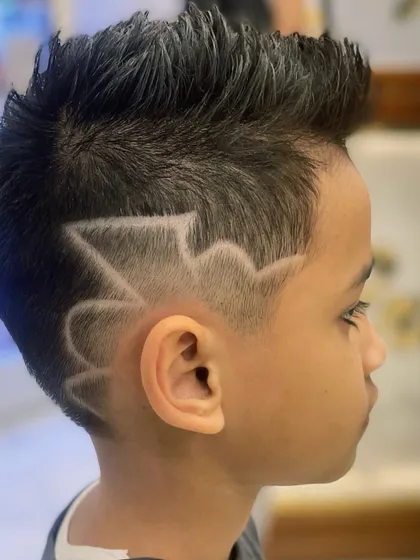 Another angle of this awesome kids' haircut, showing the clean lines and fun design.