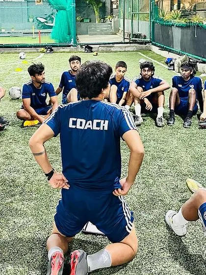 More images showcasing our dedicated coaching team during their own training sessions, meetings, and practice games.