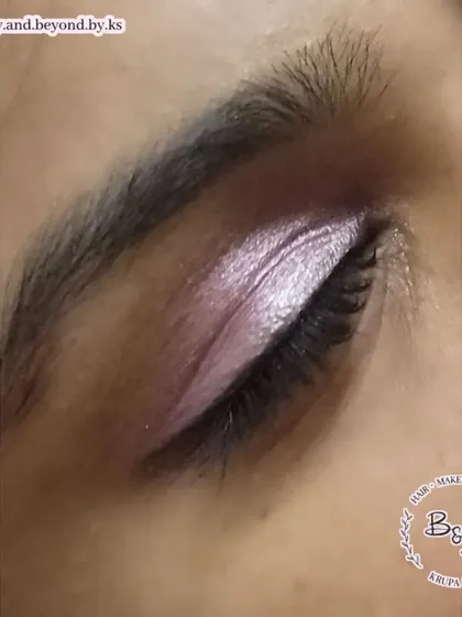 A soft and pretty eye look using shades of pink and silver. This is a great example of a minimal yet glamorous eye makeup style, perfect for a daytime event or for someone who prefers a lighter touch.