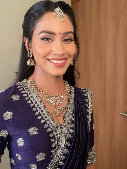 A close-up that makes you want to stop and stare. The eye makeup is beautifully defined, paired with a radiant complexion for this reception.
