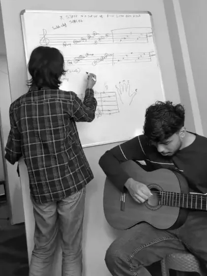 Our instructor Ragui dives into the theoretical depths of music on the whiteboard. We believe understanding theory is key to becoming a complete musician.