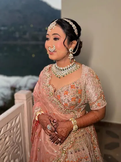 Another stunning shot of Varija. Her makeup is perfectly balanced, with defined eyes and a soft lip, creating a timeless and elegant bridal look.