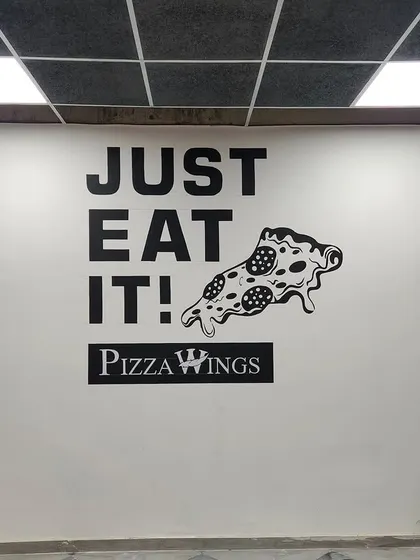 "Just Eat It!" This fun and direct typography mural for Pizza Wings uses bold, simple graphics to create an impactful and memorable piece of wall art for their customers.
