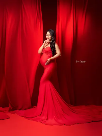 A moment of quiet contemplation amidst a sea of red. The monochromatic color scheme is incredibly striking and creates a powerful, artistic statement.