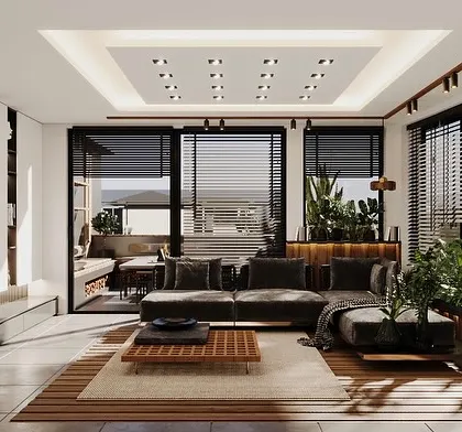 This view showcases the living area of the sunroom, with a focus on the built-in shelving and entertainment console. The design maintains a connection to the outdoors through the large, louvered windows.