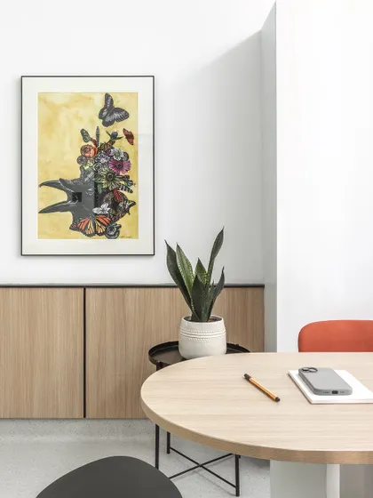 Curated artwork adds warmth and personality to the doctor's consultation room. These personal touches help foster a sense of trust and connection between patients and practitioners.