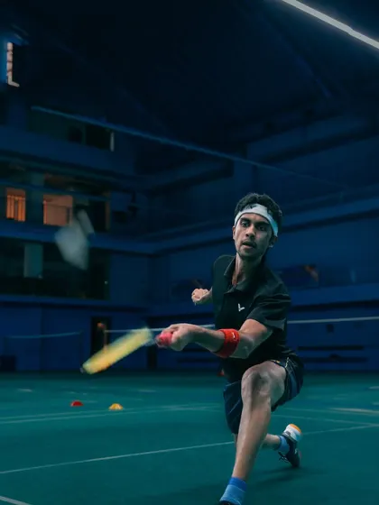 Low and ready. A player demonstrates excellent form while returning a low shot, a fundamental skill for controlling the game from the front of the court.
