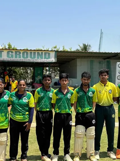 A team in green and yellow jerseys poses for a photo during the RSCA League.