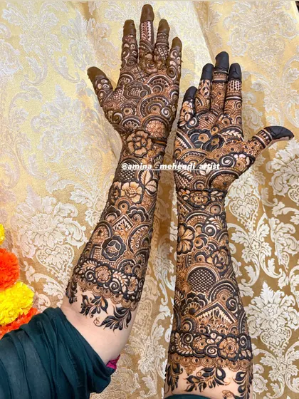 The back of a full bridal design, showing how the pattern flows beautifully from the wrist up the arm.