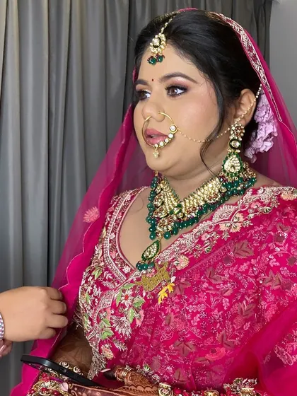 My beautiful bride Avani in a stunning pink lehenga. Her makeup was designed to be fresh and glowing, perfect for her destination wedding.