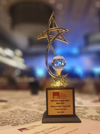 A close-up of the "Best Chapter Award" trophy from IMPA. This recognition is a testament to the collaborative spirit of our team.