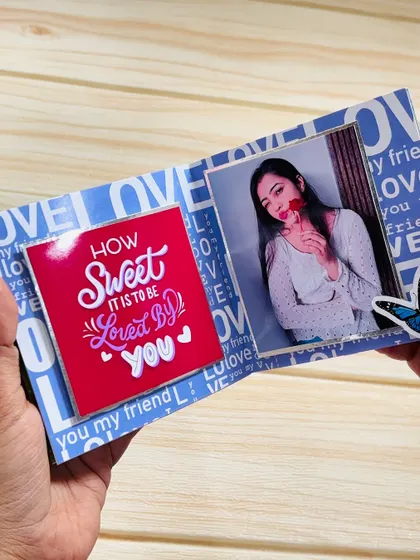 An open page from the keepsake mini album, with a photo on one side and a sweet message on the other.