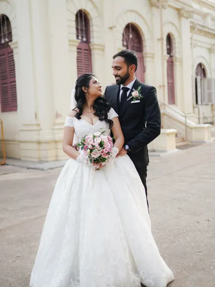A classic portrait of a bride and groom after their church ceremony, looking like they stepped out of a fairytale.